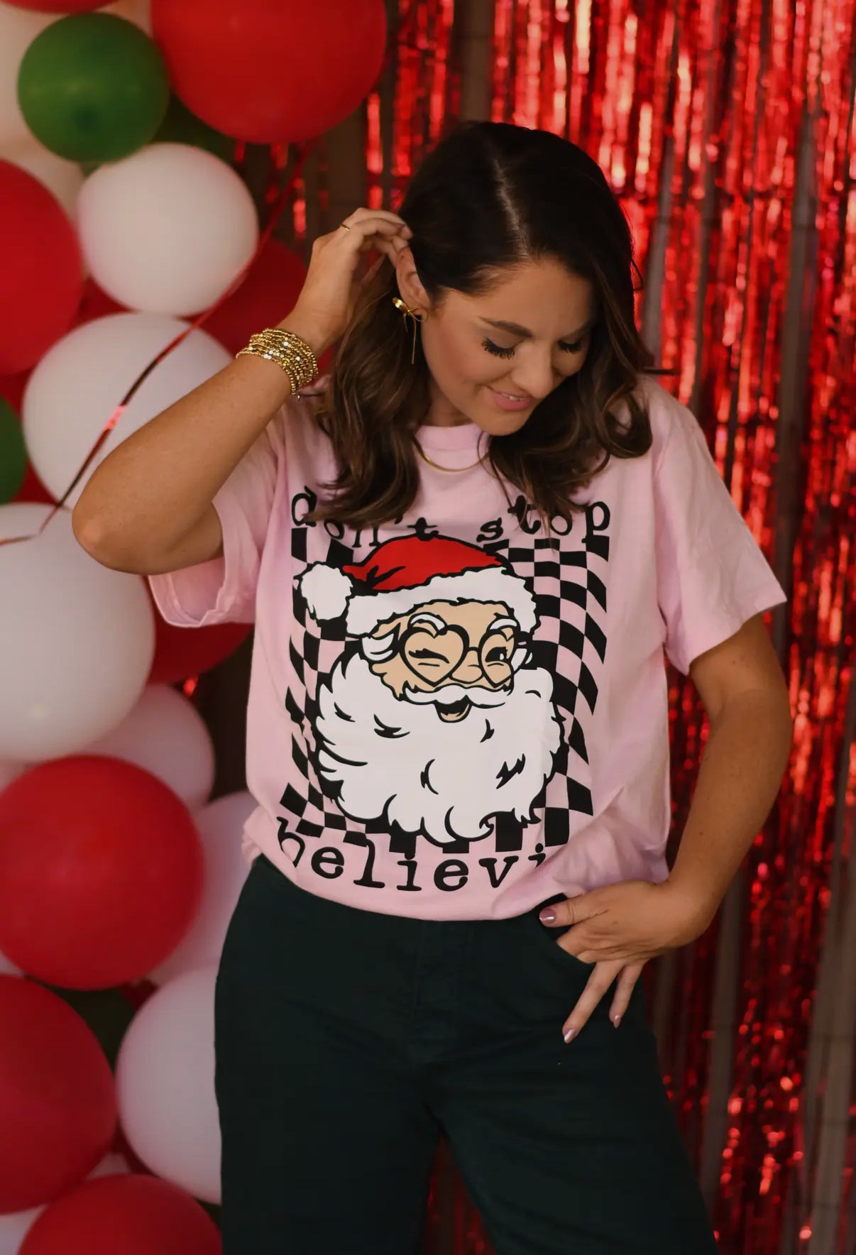 DON'T STOP BELIEVIN' SANTA PINK CHECKERED TEE