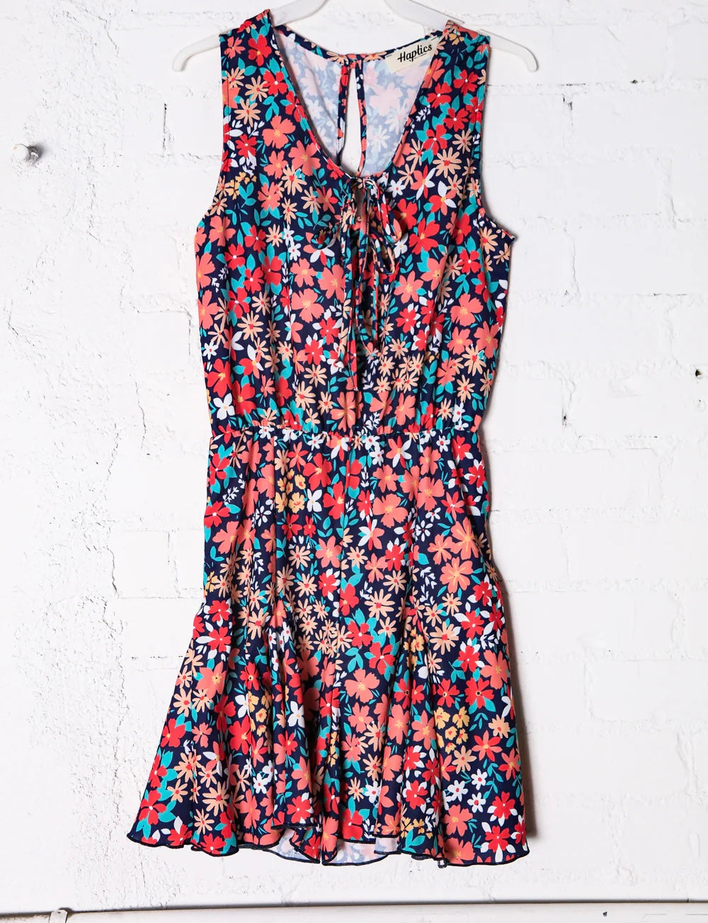 NAVY CORAL AQUA LITTLE DAISIES FLORAL RUFFLE HEM TIE FRONT VNECK ROMPER