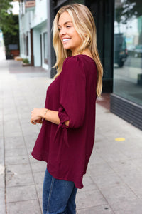 WINE CREPE WOVEN TIE SLEEVE BUBBLE BLOUSE