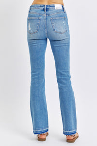 MEDIUM WASH MID RISE DESTROYED RELEASED HEM BOOTCUT JUDY BLUE DENIM