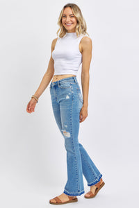 MEDIUM WASH MID RISE DESTROYED RELEASED HEM BOOTCUT JUDY BLUE DENIM