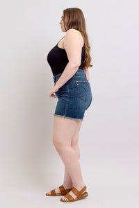 DARKWASH TUMMY CONTROL HIGH WAIST FRAYED HEM SHIELD BACK POCKETS SHORTS JUDY BLUE DENIM-PLUS