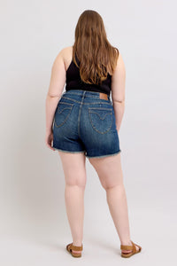 DARKWASH TUMMY CONTROL HIGH WAIST FRAYED HEM SHIELD BACK POCKETS SHORTS JUDY BLUE DENIM-PLUS