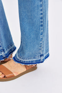 MEDIUM WASH MID RISE DESTROYED RELEASED HEM BOOTCUT JUDY BLUE DENIM