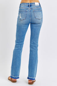 MEDIUM WASH MID RISE DESTROYED RELEASED HEM BOOTCUT JUDY BLUE DENIM