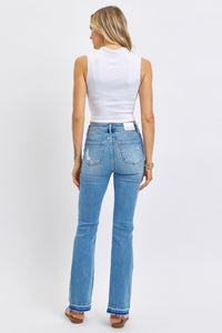 MEDIUM WASH MID RISE DESTROYED RELEASED HEM BOOTCUT JUDY BLUE DENIM