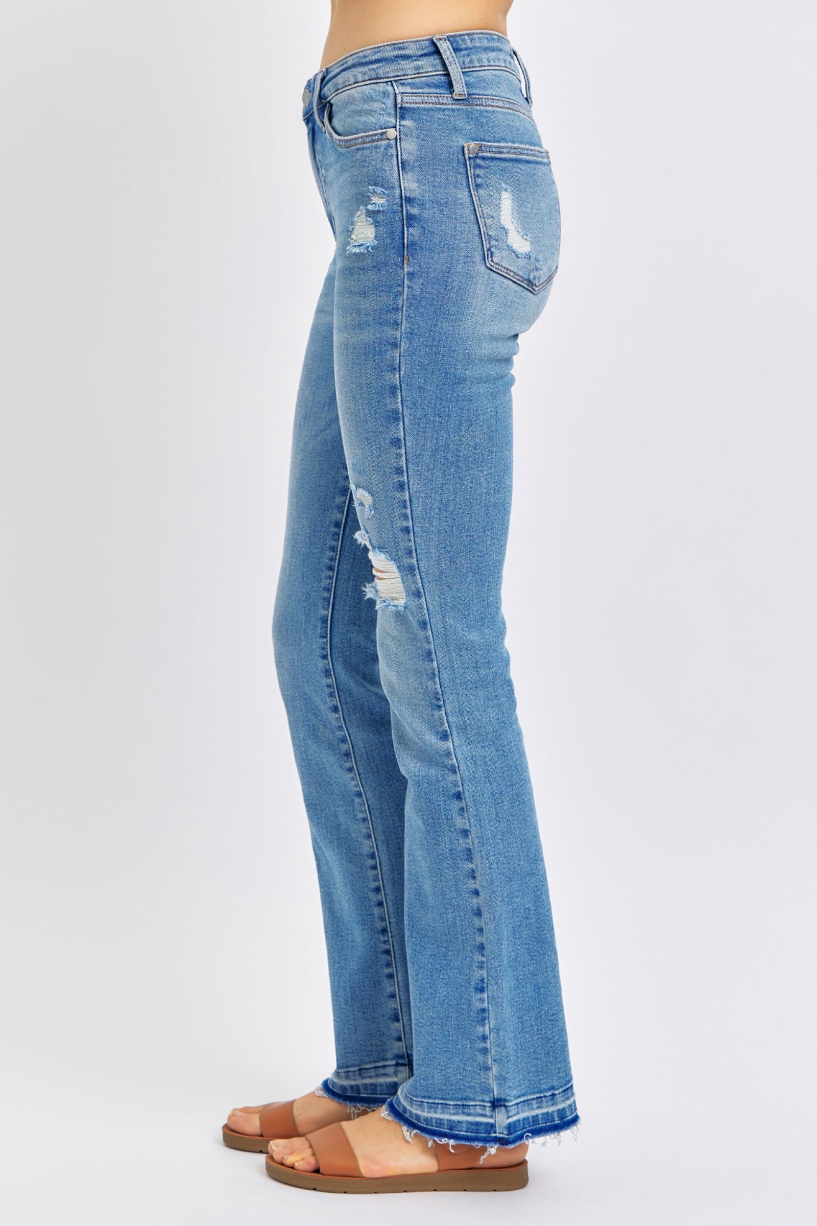 MEDIUM WASH MID RISE DESTROYED RELEASED HEM BOOTCUT JUDY BLUE DENIM