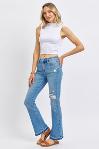 MEDIUM WASH MID RISE DESTROYED RELEASED HEM BOOTCUT JUDY BLUE DENIM