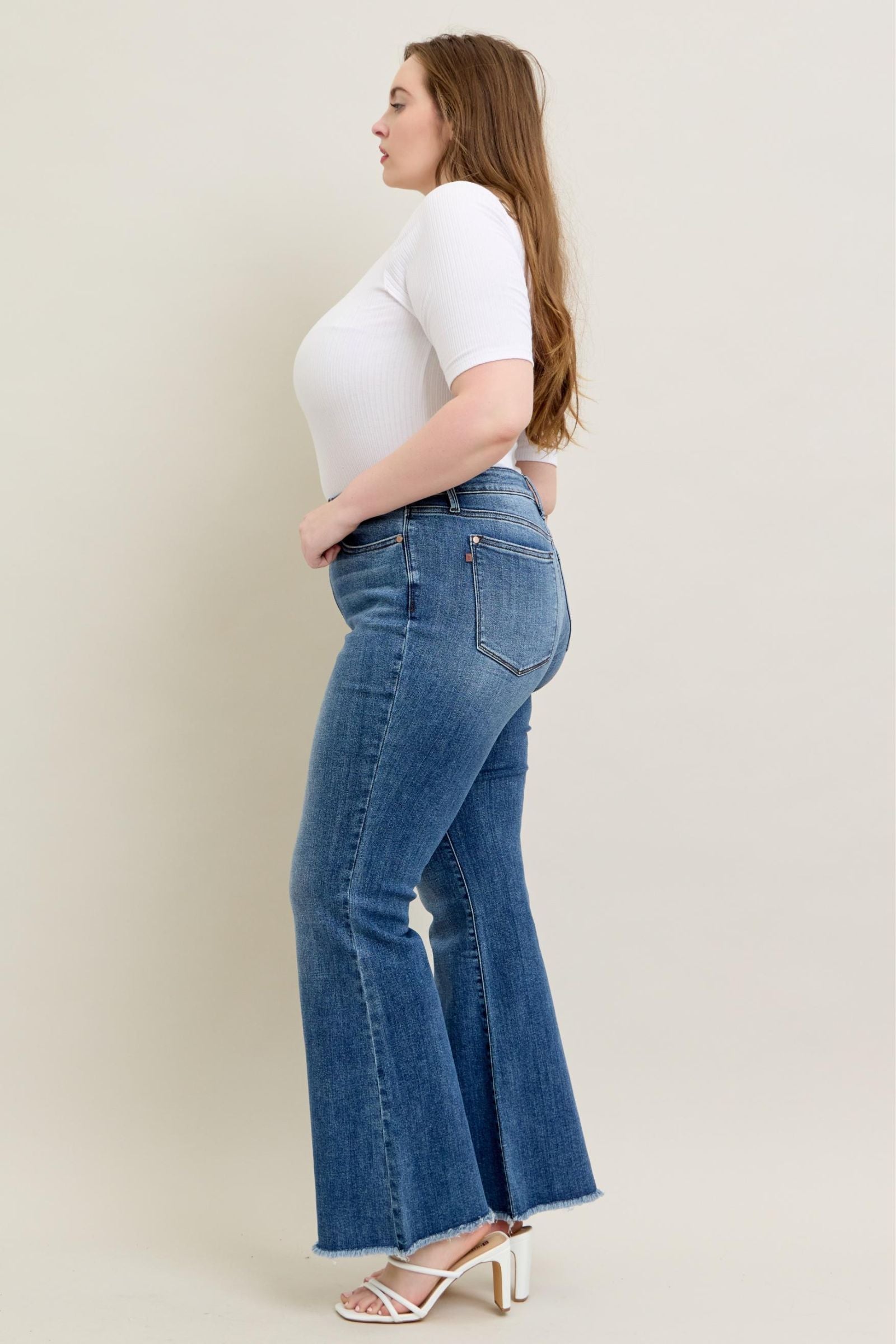 MEDIUM WASH MID RISE VINTAGE WASH FLARE DESTROYED FRAYED HEM JUDY BLUE DENIM-PLUS