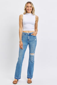 MEDIUM WASH MID RISE DESTROYED RELEASED HEM BOOTCUT JUDY BLUE DENIM