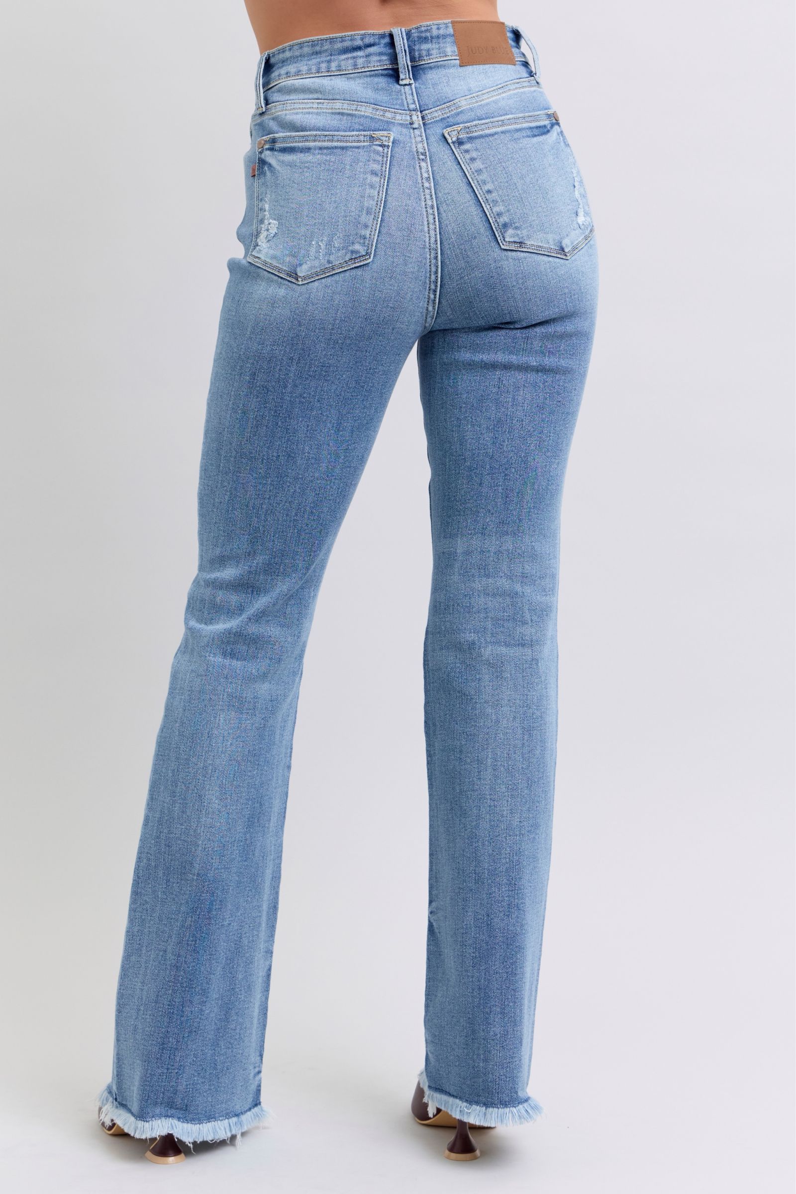HIGH WAIST MEDIUM WASH BOOTCUT JUDY BLUE DENIM FRAYED HEM
