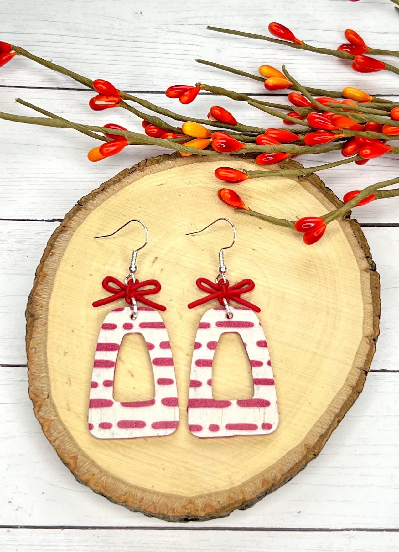RED & CREAM PRINTED LINES LEATHER GEOMETRIC SHAPE WITH RED METAL BOWS / RIBBONS HANDMADE EARRINGS BY B.O.D