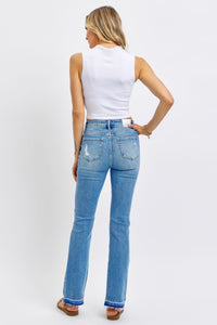 MEDIUM WASH MID RISE DESTROYED RELEASED HEM BOOTCUT JUDY BLUE DENIM