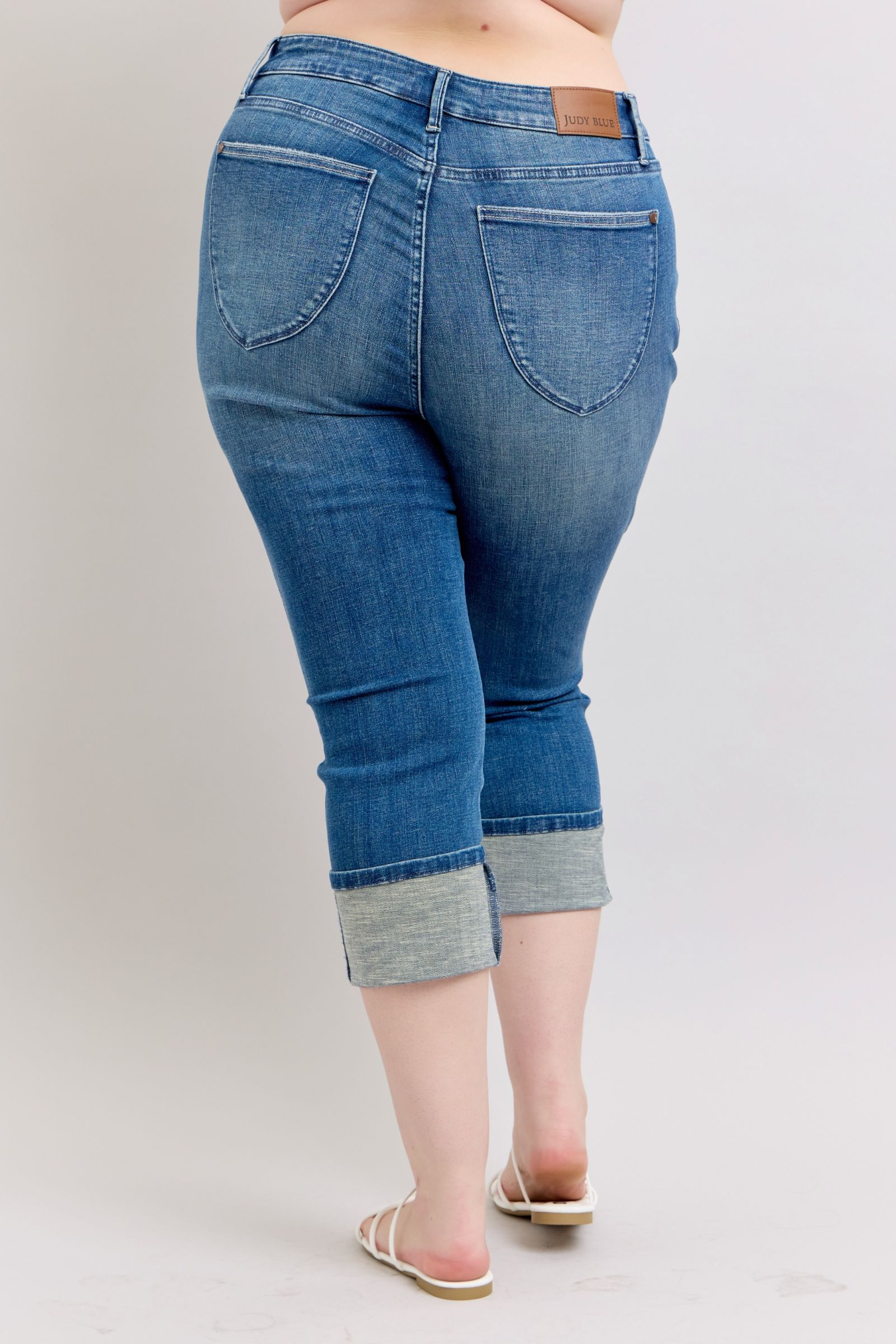 HIGH WAIST TUMMY CONTROL MEDIUM WASH BACK SHIELD POCKETS & CUFFED CAPRIS JUDY BLUE DENIM-PLUS