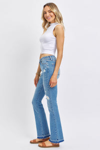 MEDIUM WASH MID RISE DESTROYED RELEASED HEM BOOTCUT JUDY BLUE DENIM