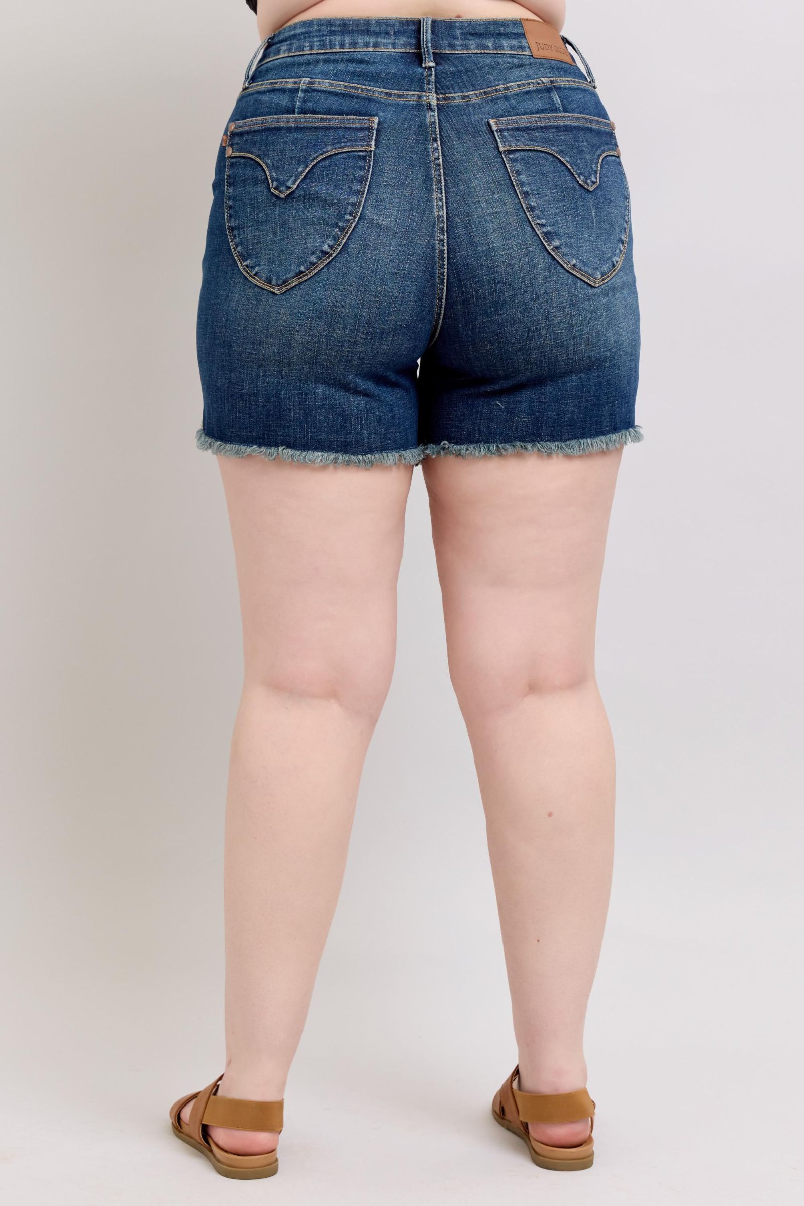 DARKWASH TUMMY CONTROL HIGH WAIST FRAYED HEM SHIELD BACK POCKETS SHORTS JUDY BLUE DENIM-PLUS
