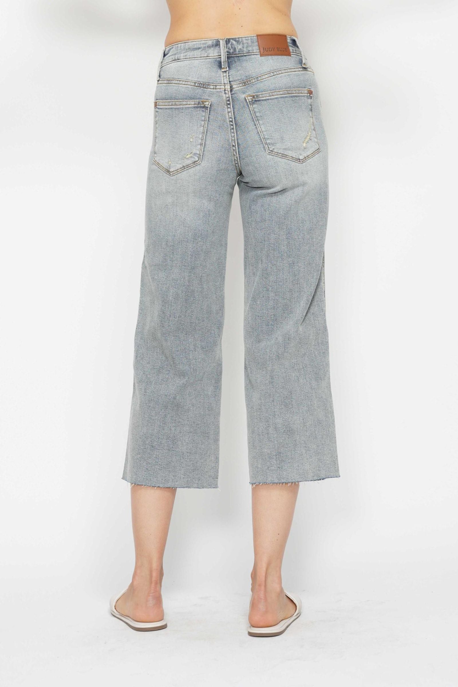 LIGHT WASH MID RISE TUMMY CONTROL RAW HEM WIDE LEG CROPPED JUDY BLUE DENIM