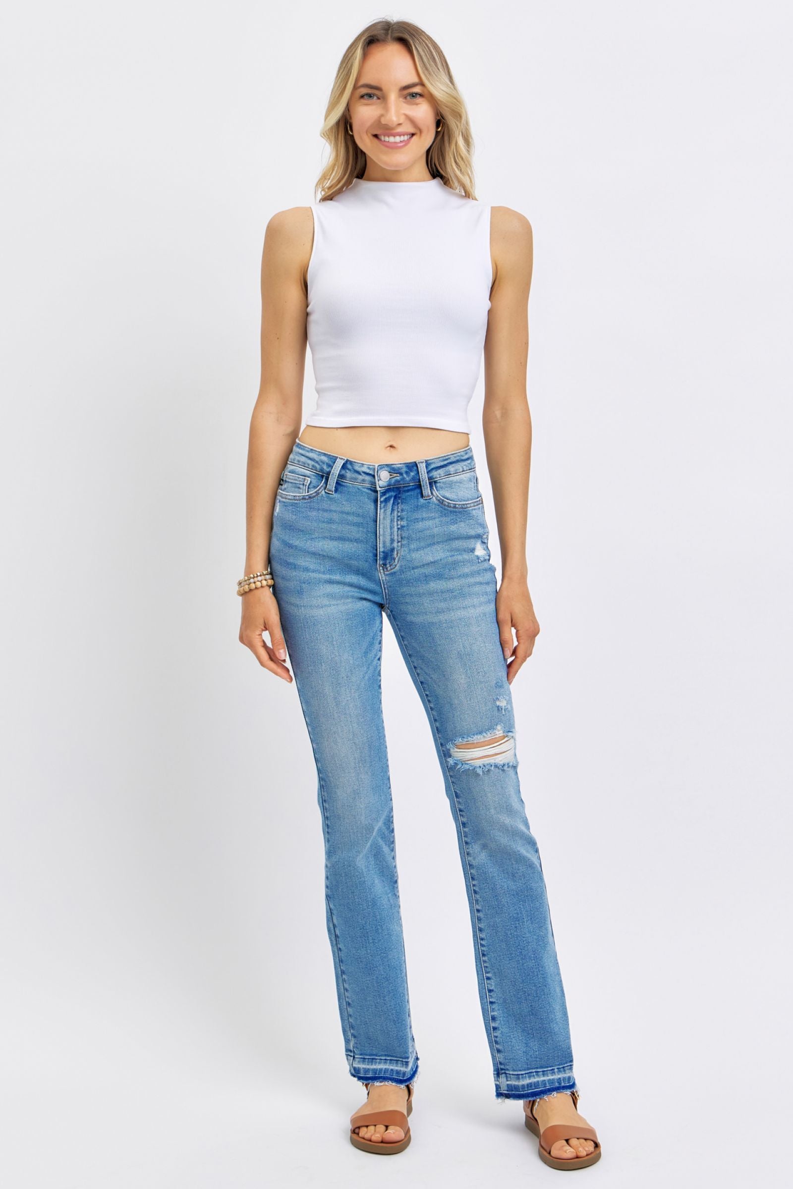 MEDIUM WASH MID RISE DESTROYED RELEASED HEM BOOTCUT JUDY BLUE DENIM