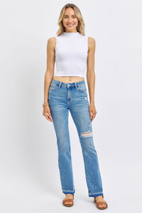 MEDIUM WASH MID RISE DESTROYED RELEASED HEM BOOTCUT JUDY BLUE DENIM