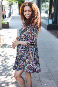 BLACK POCKETED FLORAL FIT & FLARE DRESS