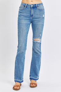 MEDIUM WASH MID RISE DESTROYED RELEASED HEM BOOTCUT JUDY BLUE DENIM